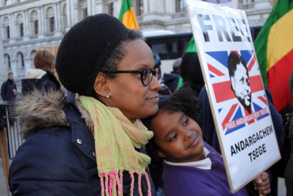 Image of Menabe and Yemi protesting to free Andy Tsege