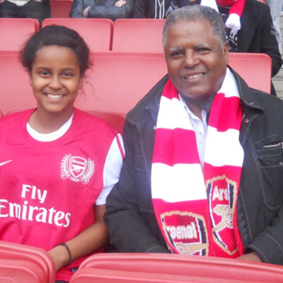 Image of Andy Tsege at Arsenal with his daughter