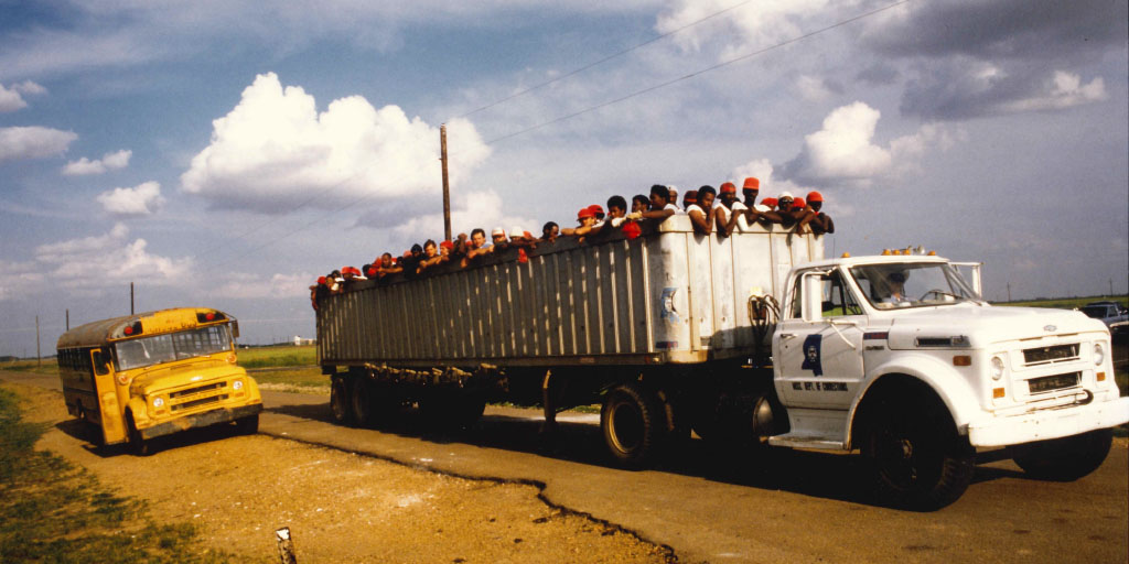 Image of prisoners being transported in a truck