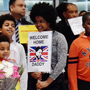 Image of Andy's children waiting for him at Heathrow