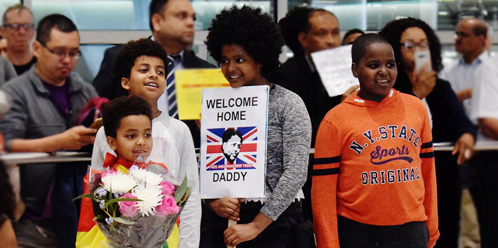 Image of Andy's children waiting for him at Heathrow