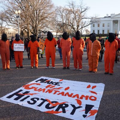 Background image of a protest against Guantanamo in Washington DC from Shutterstock
