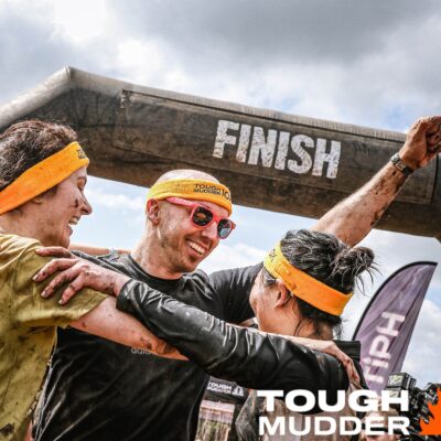 Three people completing a Tough Mudder event